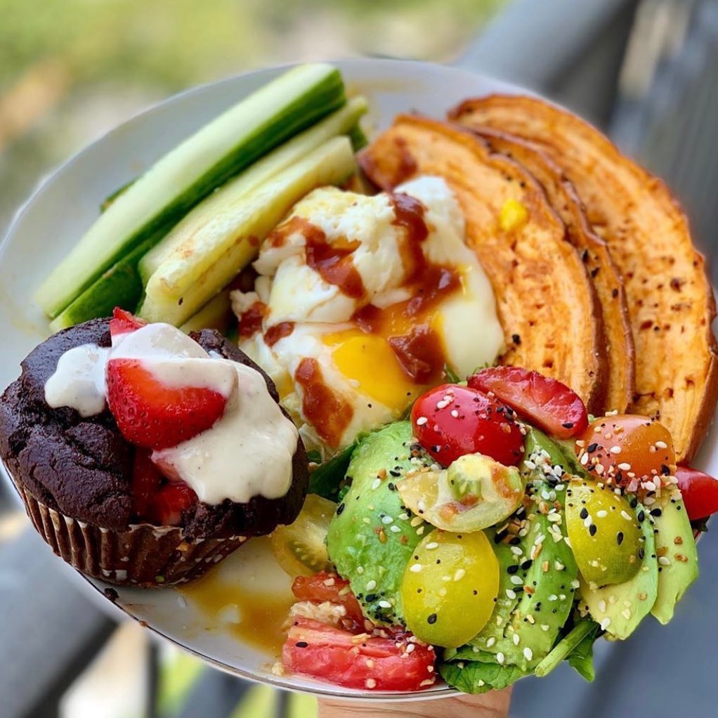 Roasted garlic sweet potatoes paired with farm‑fresh organic eggs, drizzled with True Made Foods’ no‑sugar ketchup.