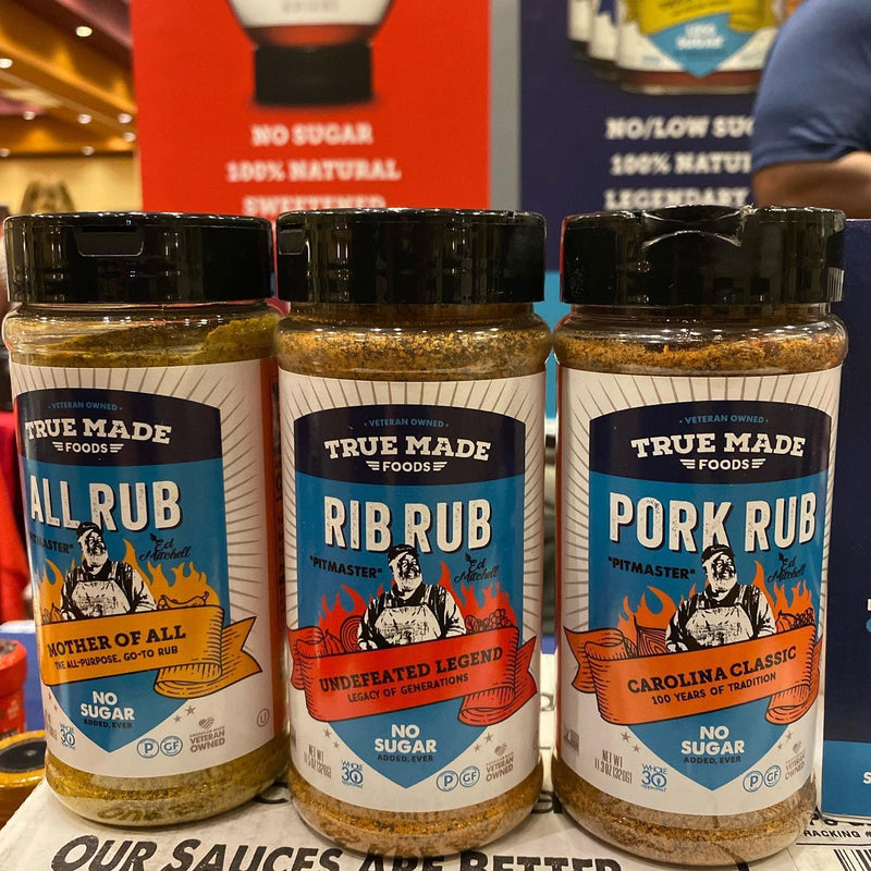 Three bottles of True Made Foods sugar-free BBQ seasonings: All Rub, Rib Rub, and Pork Rub, made with real spices and no added sugar.