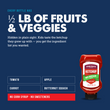 Load image into Gallery viewer, Promotional graphic for a ketchup bottle on a dark blue background. Large white text reads '1/2 LB OF FRUITS &amp; VEGGIES' with smaller copy about kids tasting the ketchup they grew up with.
