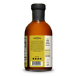 Load image into Gallery viewer, Back view of the Pitmaster Original BBQ Sauce glass bottle of sauce with a black cap and a cream and yellow label, showing product details and text on a white background.
